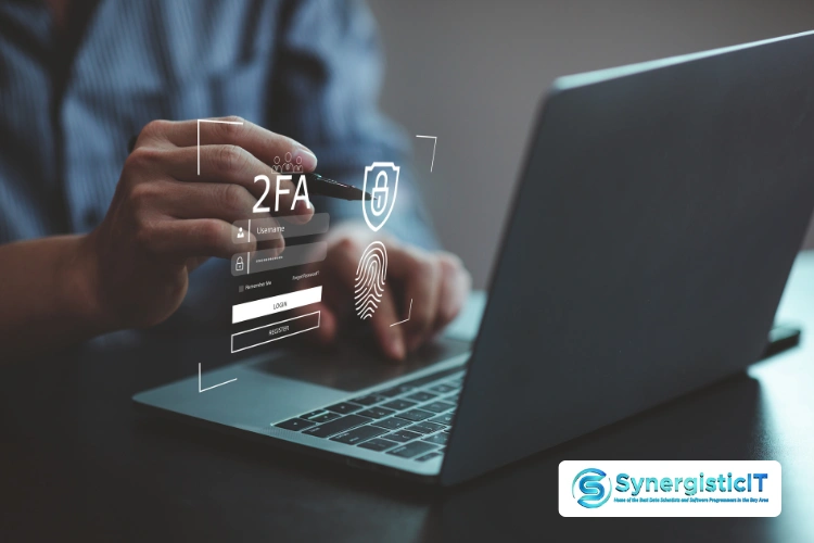 Cybersecurity authentication process on laptop screen with 2FA illustration and SynergisticIT logo
