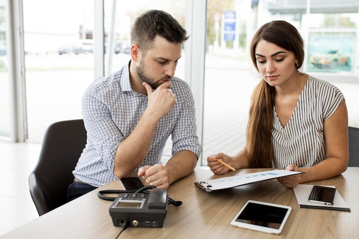 Man and woman discussing salary negotiation during a job interview.